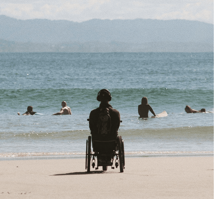 Person in wheelchair enjoying beach view