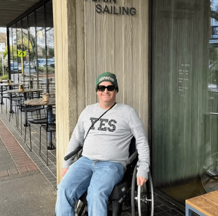 Person using a wheelchair outside a venue